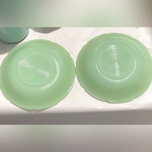 Jadeite Anchor Hocking saucers from 1945. These are EUC. Floral “Alice” Pattern
